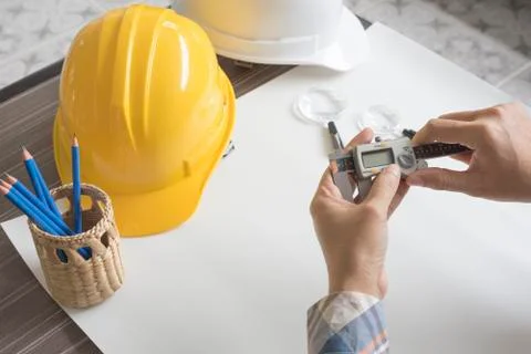 Construction engineer measuring with vernier caliper. Business and Technology Fotos Stock