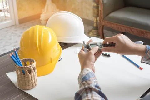 Construction engineer measuring with vernier caliper. Business and Technology 写真素材