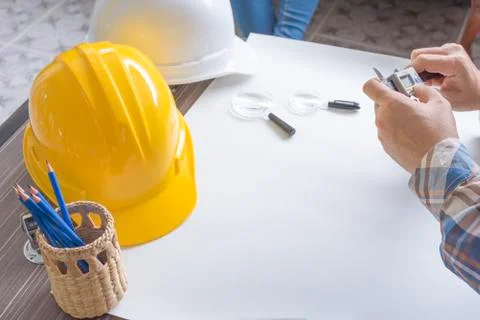 Construction engineer measuring with vernier caliper. Business and Technology Фото