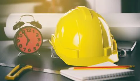 Construction Engineer office table with clock deadline concept. Stock Photos
