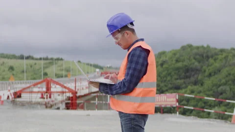 Construction engineer or an architect with a halmet and protective equipment  Stock Footage 133500504