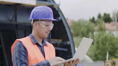 Construction engineer or an architect with a halmet and protective equipment  Stock Footage 133520462