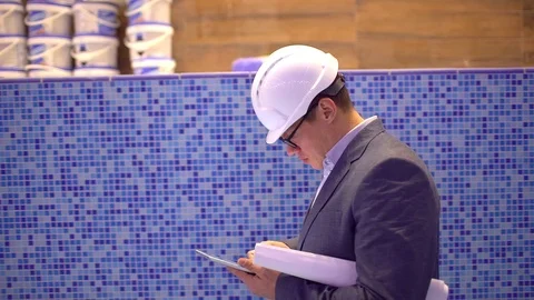 Construction engineer or architect with the tablet. construction and design of Stock Footage 87198162