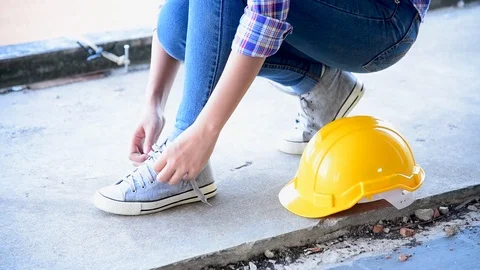 Construction engineer in Safety Suit Trust Team Holding White Yellow Safety hard Stock Footage 123747601