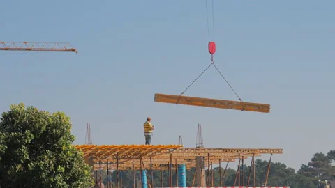 Construction engineer supervising work at building site Stock Footage 87316070