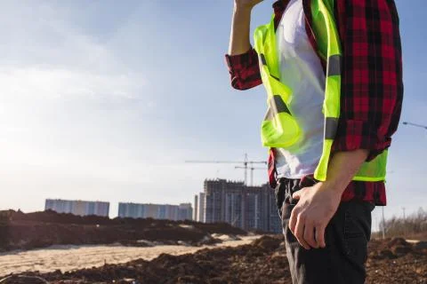 Construction engineer talking on the phone, discussing project details Photos