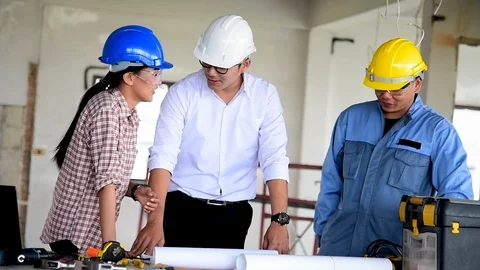 Construction engineer teamwork Safety Suit Trust Team Holding White Yellow Safet Stock Footage 122215954