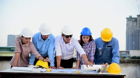 Construction engineer teamwork Safety Suit Trust Team Holding White Yellow Safet Stock Footage 123747741