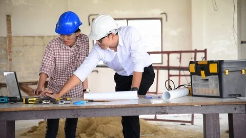 Construction engineer teamwork Safety Suit Trust Team Holding White Yellow Safet Stock-Footage 123751462