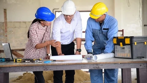Construction engineer teamwork Safety Suit Trust Team Holding White Yellow Safet Stock Footage 123995428