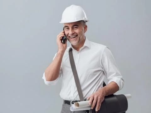 Construction engineer using a smartphone Stock Photos