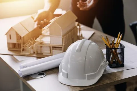 Construction engineer working at blueprint to build large commercial buildi.. Stock Photos