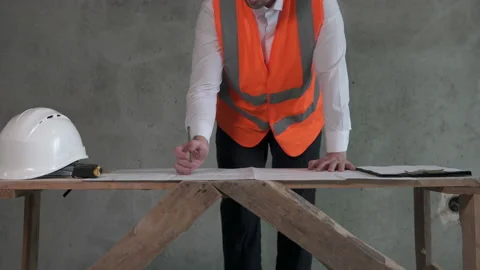 Construction engineer working with blueprints at work Video stock 155001879