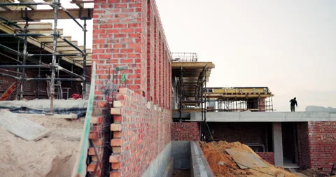 Construction, engineering and building at site, brick wall and concrete for Stock Footage 336262643