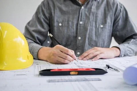 Construction engineering or architect hands working on blueprint inspection i Foto stock