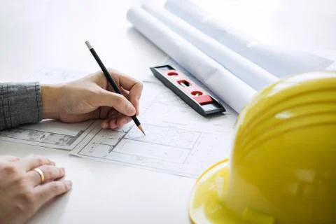 Construction engineering or architect hands working on blueprint inspection i Stock Photos