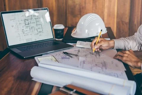 Construction engineering or architect hands working on blueprint inspection i Stock Photos