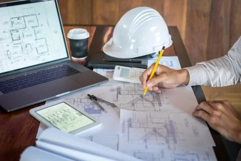 Construction engineering or architect hands working on blueprint inspection i Stock Photos
