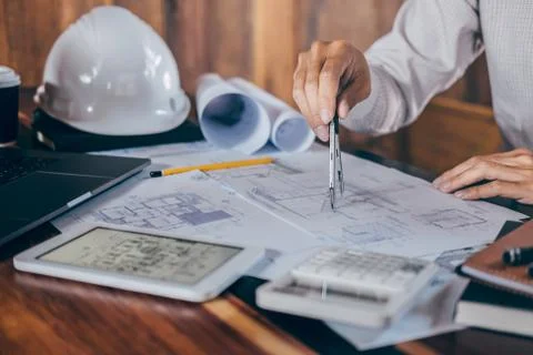 Construction engineering or architect hands working on blueprint inspection i Stock Photos