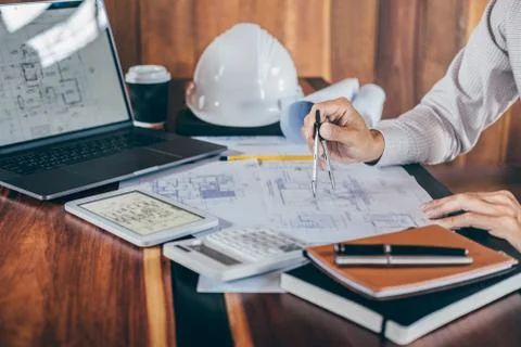 Construction engineering or architect hands working on blueprint inspection i Stock Photos