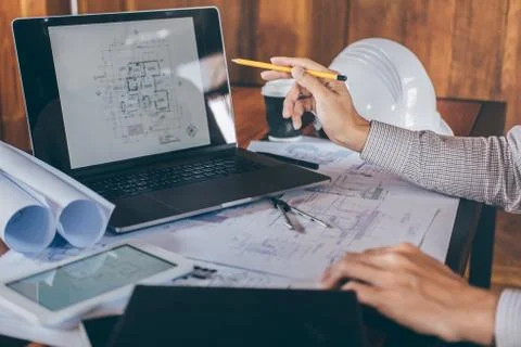 Construction engineering or architect hands working on blueprint inspection i Stock Photos