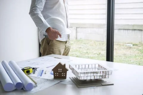Construction engineering or architect working on blueprint inspection in work Stock Photos
