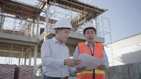 Construction engineering team inspecting the construction house site. Stock Footage 171615916