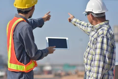 Construction Engineering use white tablet application working building estate Stock Photos