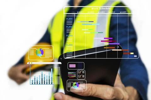 Construction engineers calculate construction site budgets, manage material.. Stock Photos