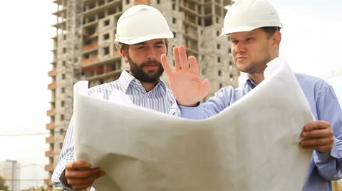 Construction engineers at construction site. 2 shot Stock Footage 35512003