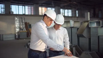 Construction Engineers Consult With Touchscreen Tablet For Building Development Stock Footage 85881253