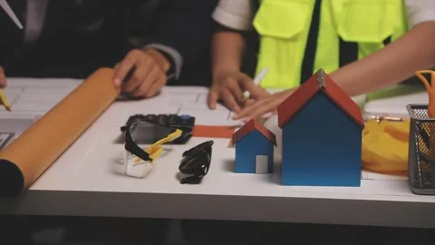 Construction engineers discussing project in office Stock Footage 331670501