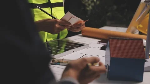 Construction engineers discussing project in office Stock Footage 331670860
