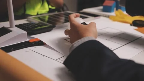 Construction engineers discussing project in office Stock Footage 331671205