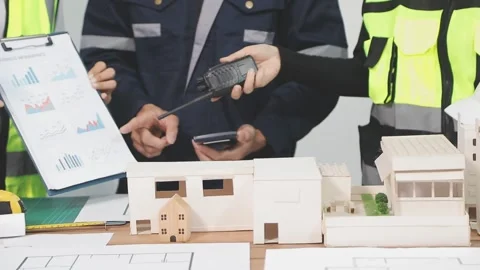 Construction engineers discussing project in office Stock Footage 331671409