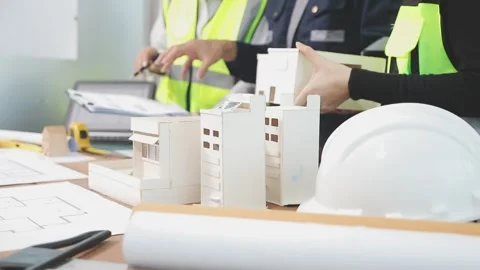 Construction engineers discussing project in office Stock Footage 331671446