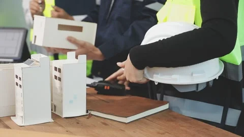 Construction engineers discussing project in office Stock Footage 331671447