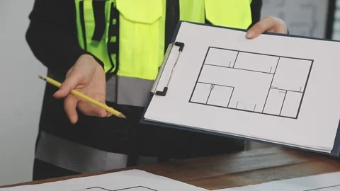 Construction engineers discussing project in office Stock Footage 331671893