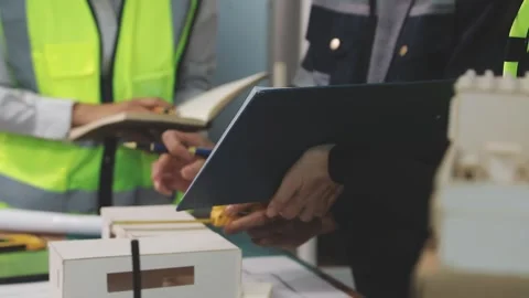 Construction engineers discussing project in office Stock Footage 331672087
