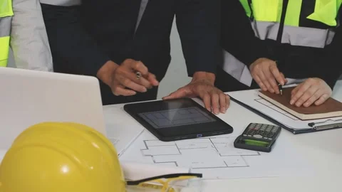 Construction engineers discussing project in office Stock Footage 331672148