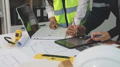 Construction engineers discussing project in office Stock Footage 331672391