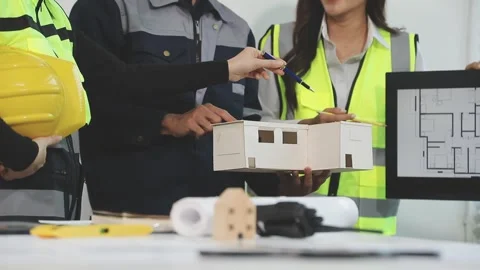Construction engineers discussing project in office Stock Footage 331672581