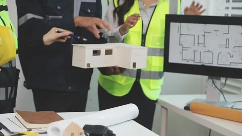 Construction engineers discussing project in office Stock Footage 331672609