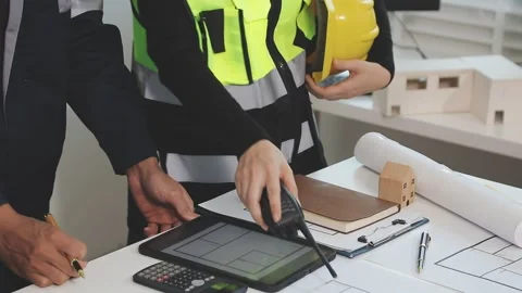 Construction engineers discussing project in office Stock Footage 331672705