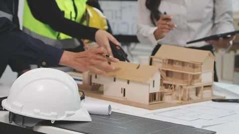 Construction engineers discussing project in office Stock Footage 331672751