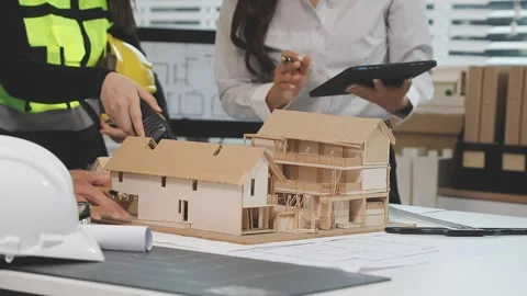 Construction engineers discussing project in office Stock Footage 331672814