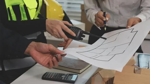 Construction engineers discussing project in office Stock Footage 331672904