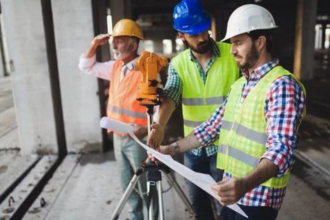 Construction engineers discussion with architects at construction or building Fotos de archivo