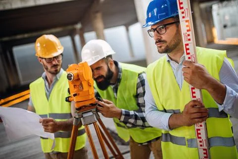 Construction engineers discussion with architects at construction or building Fotos de archivo