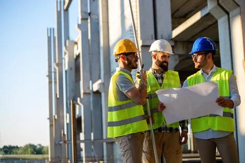 Construction engineers discussion with architects at construction or building Fotos de archivo